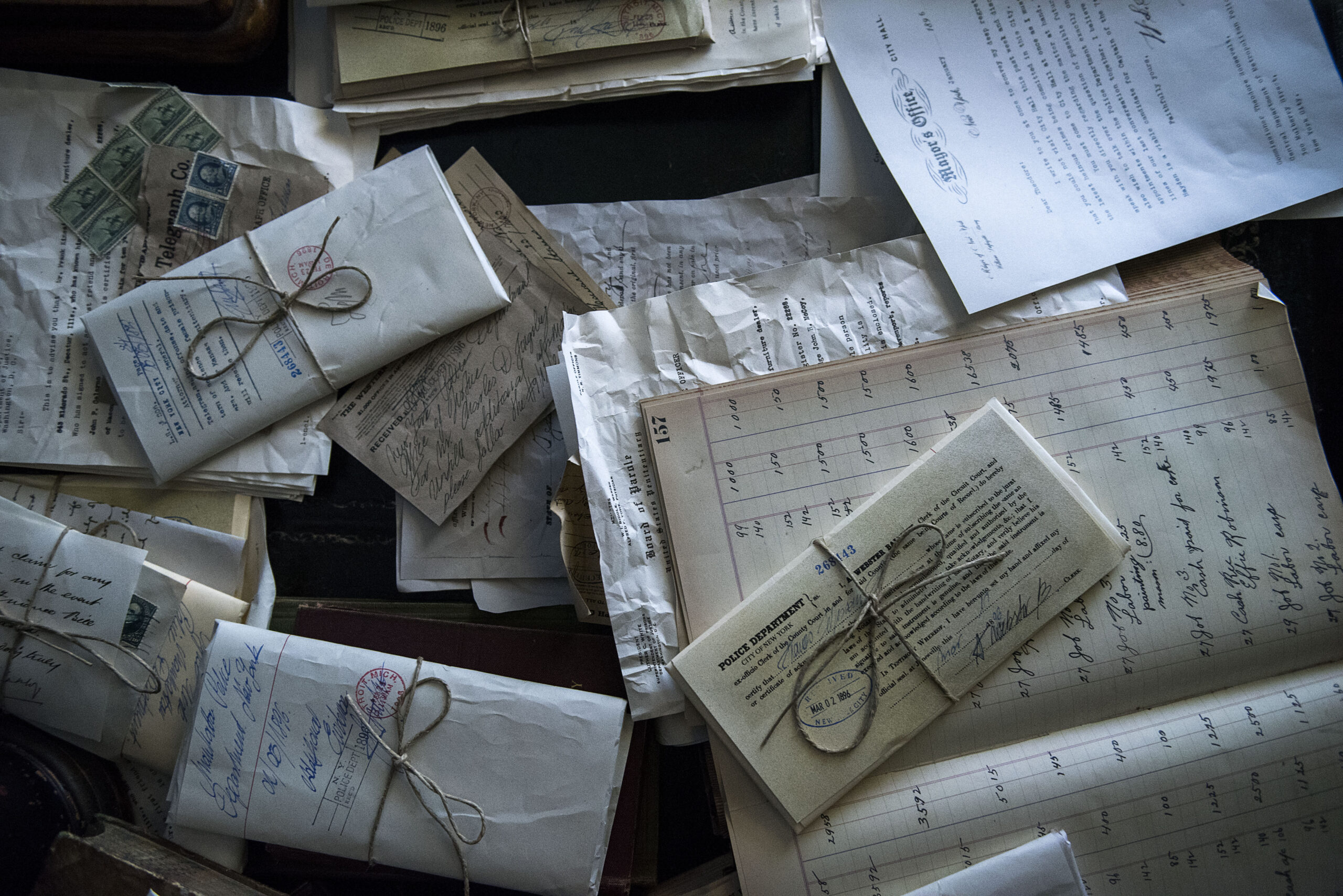 Papers and pages and parcels spread on a table