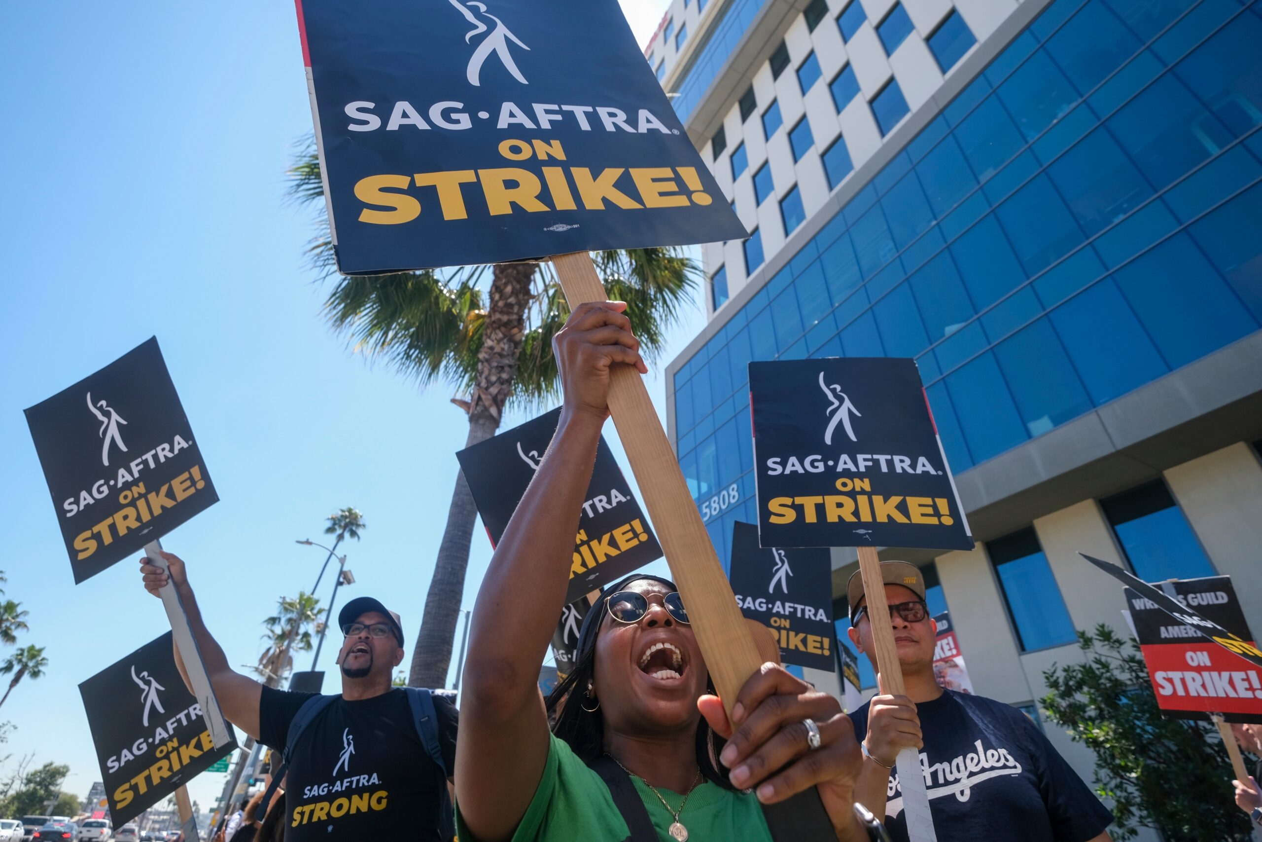 People with signs supporting the SAG-AFTRA Actors' Strike